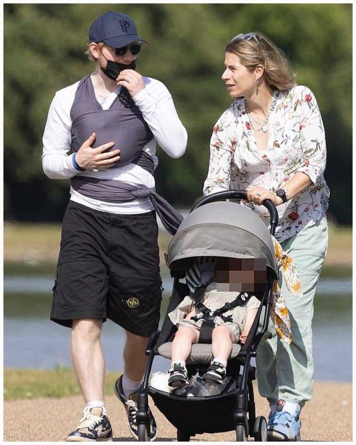 Jupiter Seaborn Sheeran is with her parents while she is on a stroller Jupiter Seaborn Sheeran is with her parents while she is on a stroller