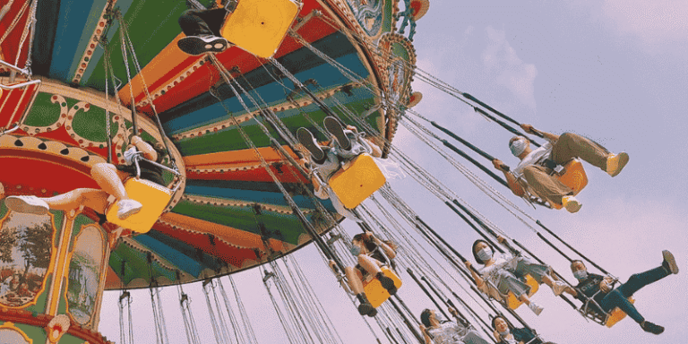 Families enjoy a fun-filled ride together at an amusement park during vacation.