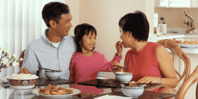A family shares a meal together at the dining table.