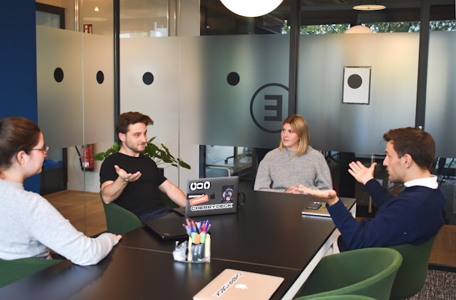 Colleagues discussing calmly in a meeting, showing benefits of neutral arguments. Colleagues discussing calmly in a meeting, showing benefits of neutral arguments.