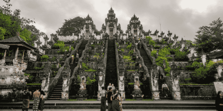 Visitors exploring the grand stairway of Lempuyang Temple in Bali, one of the cultural highlights near Nusa Penida
