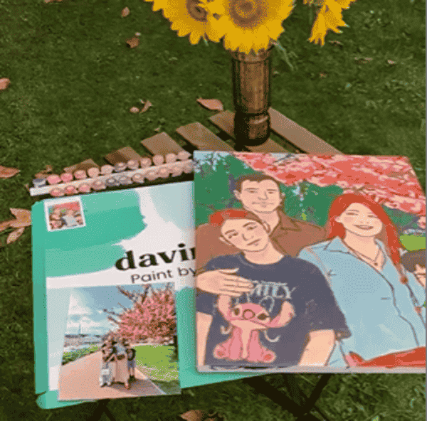 Multi-generational family enjoying paint by numbers together at home with devices put away