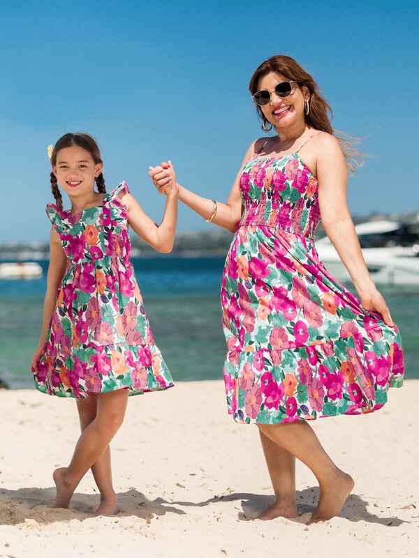 Mother and daughter wearing matching dress Mother and daughter wearing matching dress